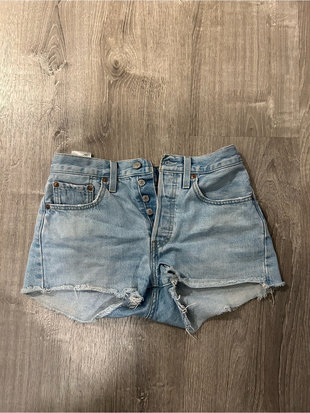 Levi’s 501 High Rise Light Blue Distressed Denim Button-Front Shorts
